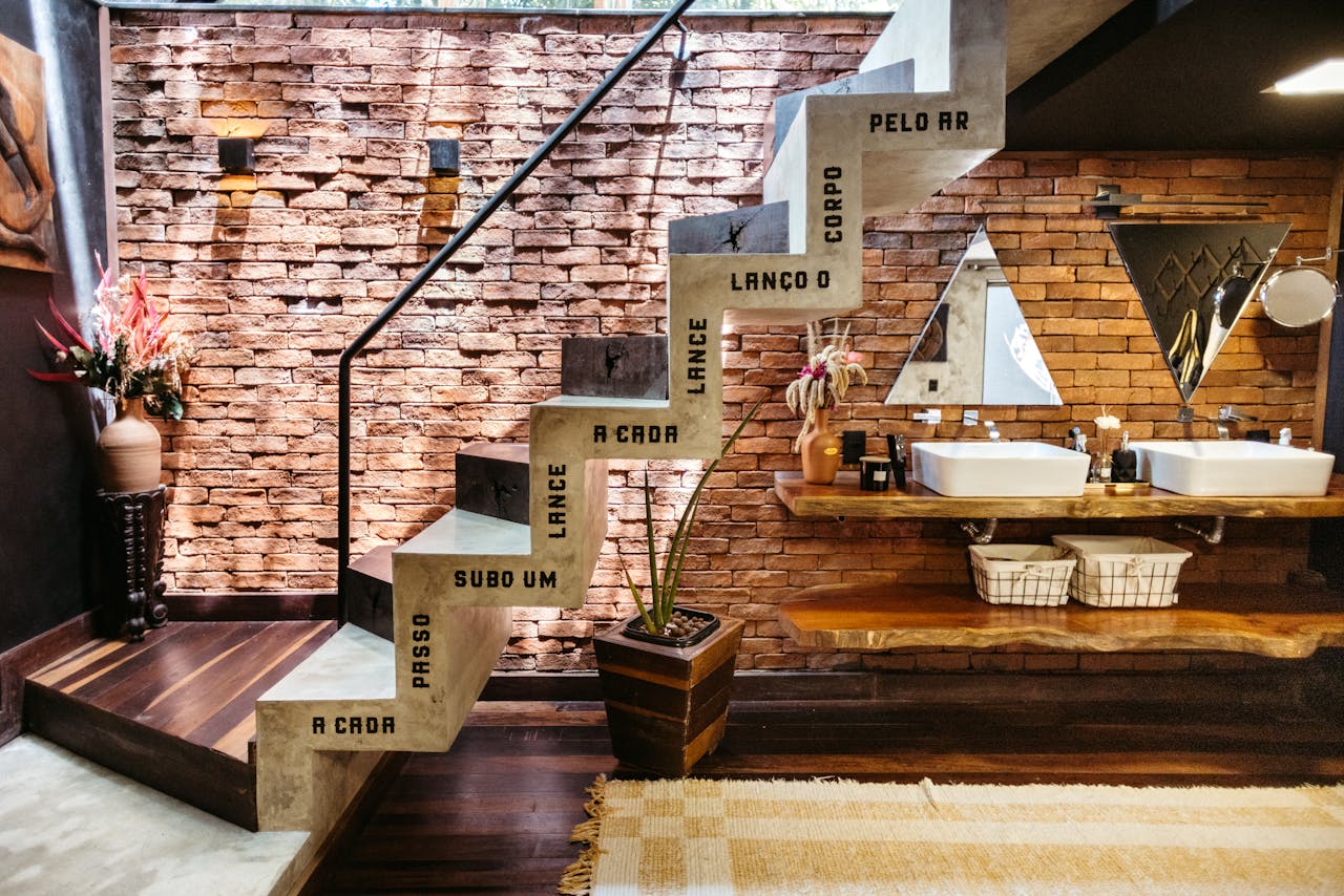 Stylish bathroom with concrete stairs and wooden decor in Santa Teresa, Brazil.